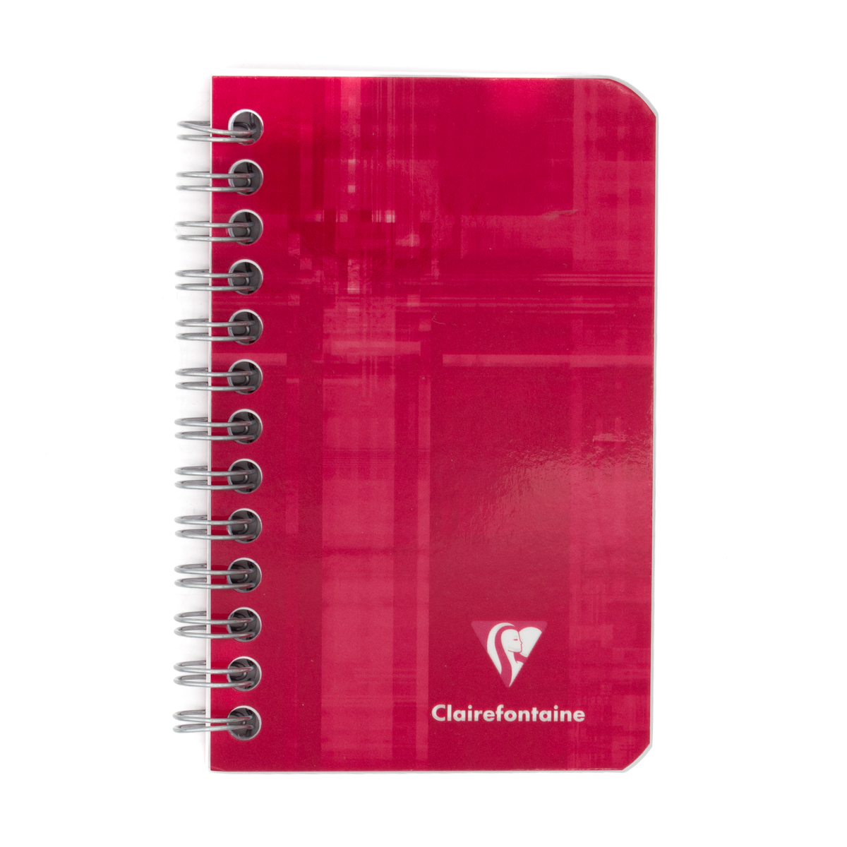 A red side wirebound notebook with the Clairefontaine logo located in the bottom right corner on a white background.