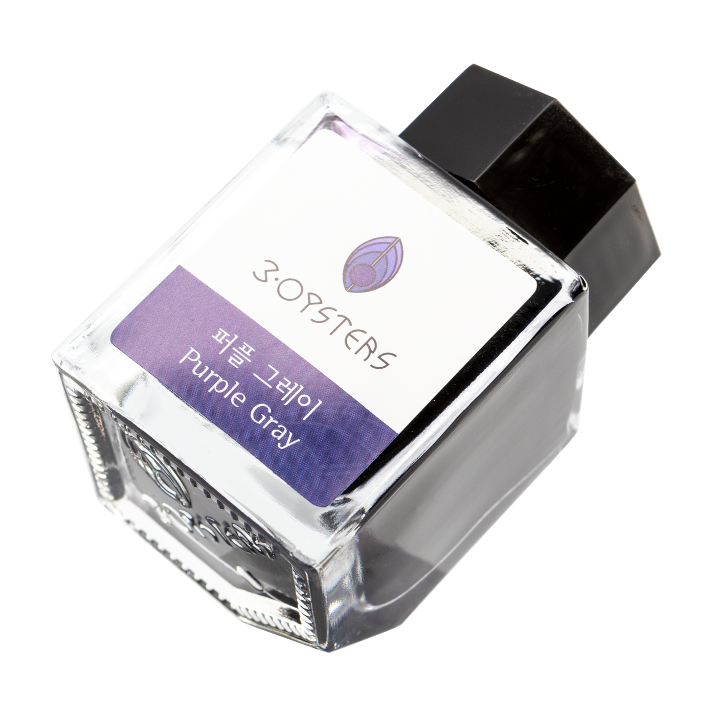 3 Oysters Purple Gray from the Delicious collection is a dark cool-tone purple fountain pen ink with low shading. It dries in 30 seconds in a medium nib on Rhodia and has a dry flow. The glass bottle has a cut out corner to lean the bottle for a decorative display. 3 Oysters ink is made in Korea. Pantone color: 5275C