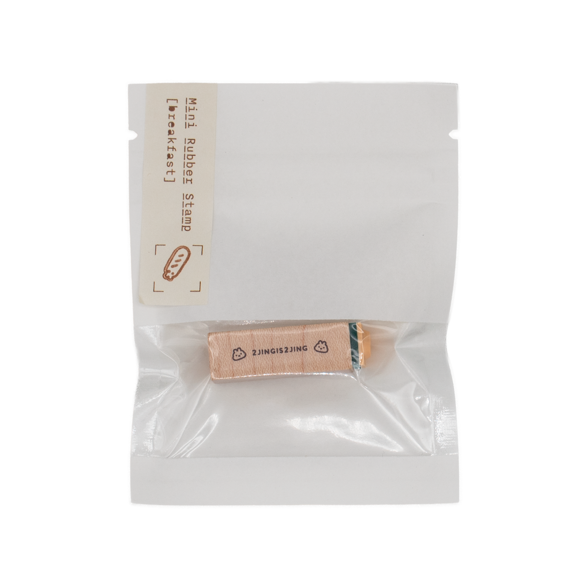 A mini wooden stamp block in a clear and white plastic bag labeled 'Mini Rubber Stamp [breakfast]' on a plain white background. 