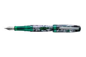 A fountain pen with the lid posted. This pen has a shimmer black, silver, and green marble patterned barrel with translucent green accents and a silver clip, shown diagonally on a plain white background.