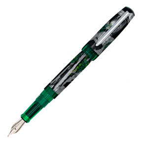 A fountain pen with a shimmer black, silver, and green marble patterned barrel with translucent green accents and a silver clip, shown diagonally on a plain white background.