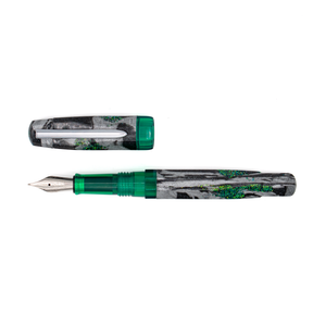 A fountain pen and its cap shown on a plain white background. The pen has a translucent green grip and cap band with a black and silver marbled body with green shimmer accents, with a silver clip and a silver nib.