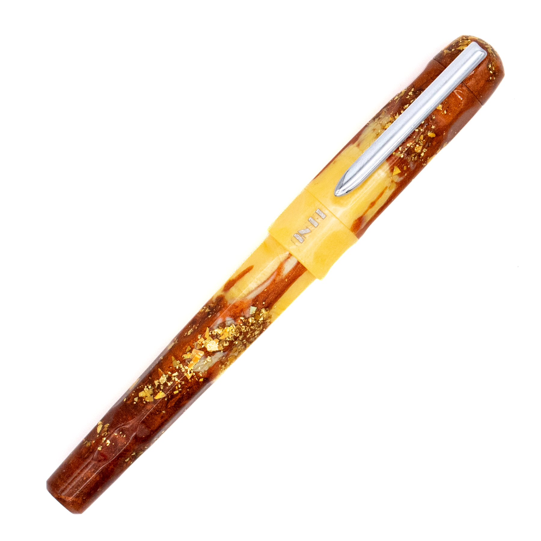 A fountain pen with yellow and amber marble and gold flake accents with a silver nib and clip. The BENU logo is engraved with silver under the clip. The pen is photographed diagonally on a clean white background.