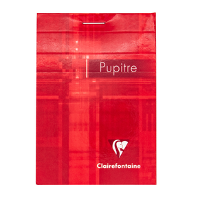 A red top staple bound notepad with the text 'Pupitre' and the Clairefontaine logo in the bottom right corner on a white background.