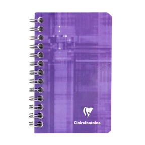 A purple side wirebound notebook with the Clairefontaine logo located in the bottom right corner on a white background.