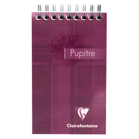 A plum-toned purple top wire bound notepad with text that says 'Pupitre' and the Clairefontaine logo located in the bottom right corner of the cover. 