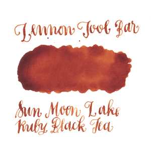 Dark orange ink swatch on a white background. Lennon Tool Bar 'Sun Moon Lake Ruby Black Tea'