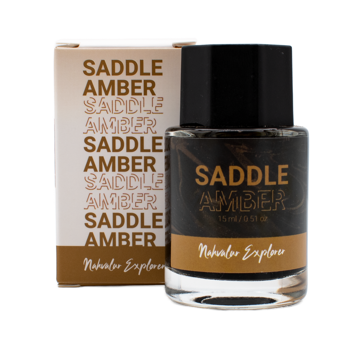 A 15 ml bottle of 'Saddle Amber' in the Nahvalur Explorer collection with its box on a plain white background.