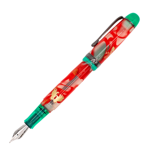 An uncapped and posted red and green translucent fountain pen with gold decorative details and a silver nib with black trim details, shown diagonally on a plain white background.