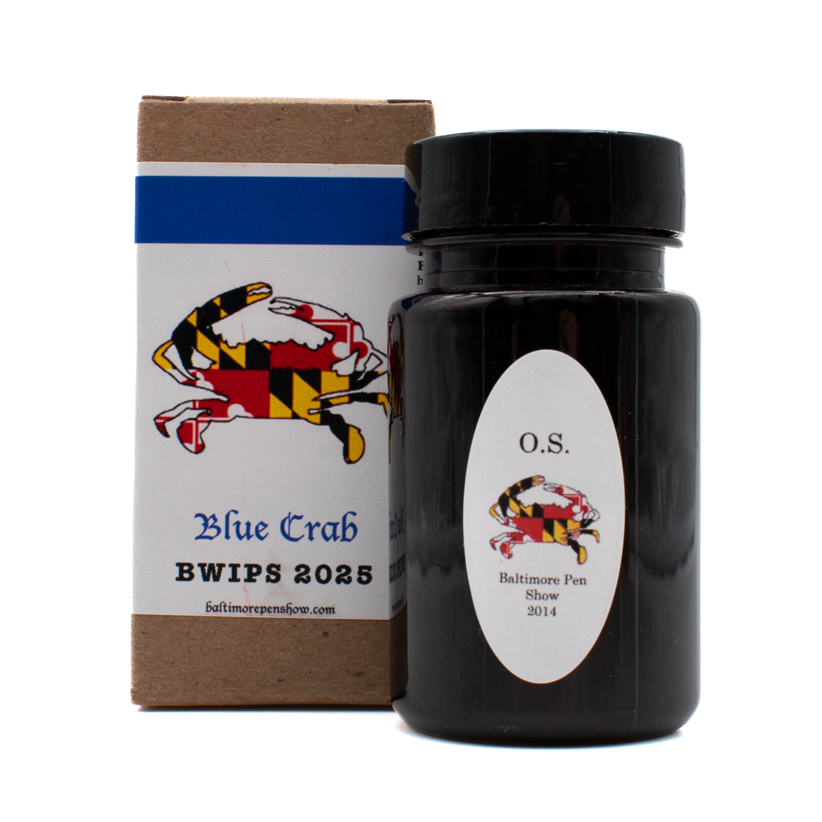 A bottle of Organics Studio 'Blue Crab' in front of its brown box with a white and blue label and black text on a white background.