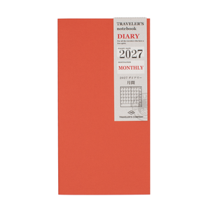 An orange 2027 Monthly Traveler's notebook on a plain white background.