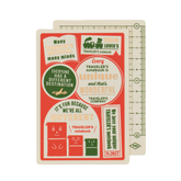 Two passport sized pencil boards stacked to show the front and back details. The top board has a cream boarder with a red background and travel illustrations in cream, red and green. The board in the back is cream with green ruler and graph detailing on a plain white background.