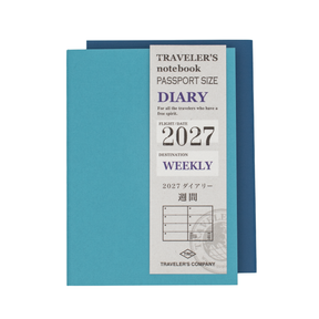 Two Traveler's notebook (light blue and dark blue) Diary Weekly for 2027 stacked on each other on a plain white background.