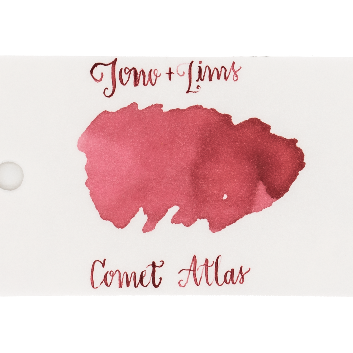 An ink swatch in a muted red on white paper, with the text 'Tono+Lims' at the top and 'Comet Atlas' at the bottom in matching red script on a plain white background.