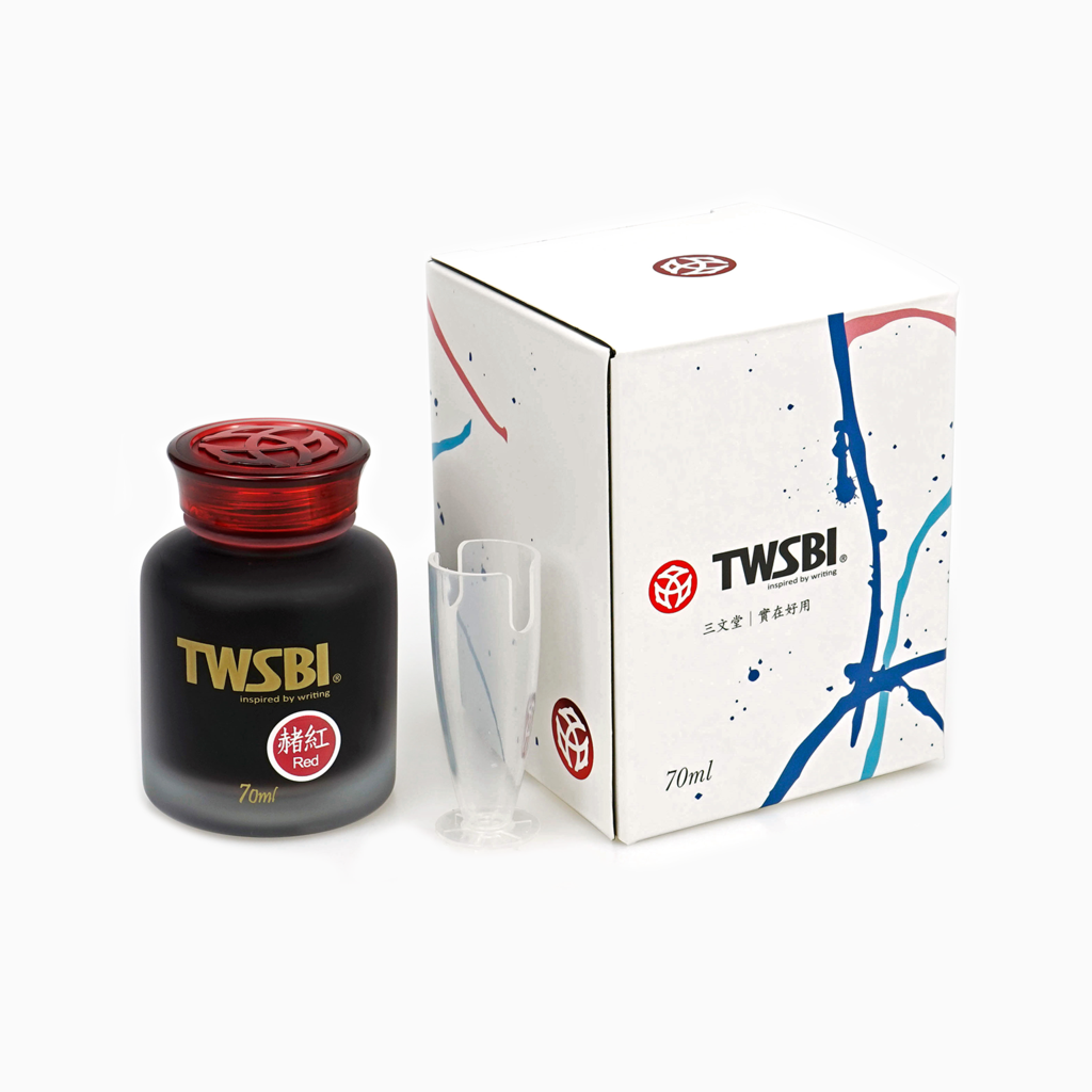 TWSBI Red is a medium red fountain pen ink that leans toward pink, with low shading. It dries in 30 seconds in a medium nib on Rhodia paper