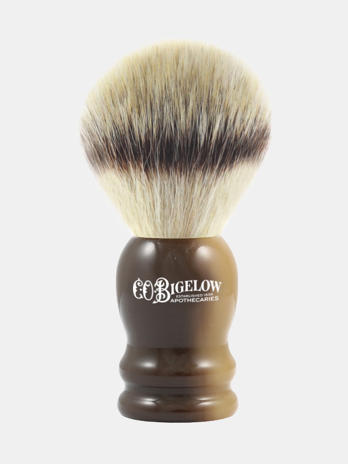 Designed to mimic badger hair for an exceptional shaving experience, this synthetic fiber shaving brush helps produce a rich lather while its fine tips lift and soften facial hair. It cleanses and massages the face, resulting in a clean and comfortable shave. Complete your ultimate shaving experience with a matching C.O. Bigelow Safety Razor. Bristles: Synthetic Fiber Horn Handle Hand Made in England