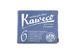 Kaweco Midnight Blue is an desaturated blue black fountain pen ink with medium shading and a pop of brown sheen in large swabs. It dries in a quick 10 seconds in a medium nib on Rhodia and has an average flow. Kaweco ink is made in Germany.