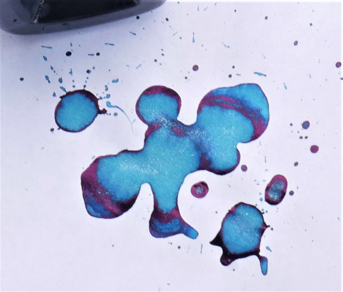 Fountain pen ink from Organics Studio, handmade in Maryland. If you are seeking a good sheening fountain pen ink, then this is for you! A Royal blue ink, with strong red to purple sheen even with less than fountain pen friendly paper.